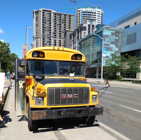 School bus driven by a fascist onto the sidewalk at the anti-hate rally in front of City Hall on August 10, 2019 (Image Credit: Karl Andrus)