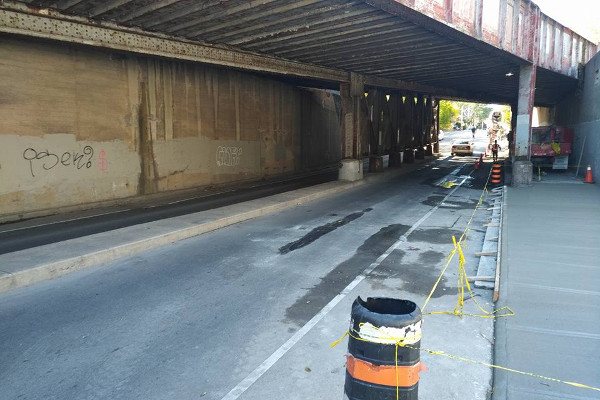 Sidewalk closed on Young through rail underpass