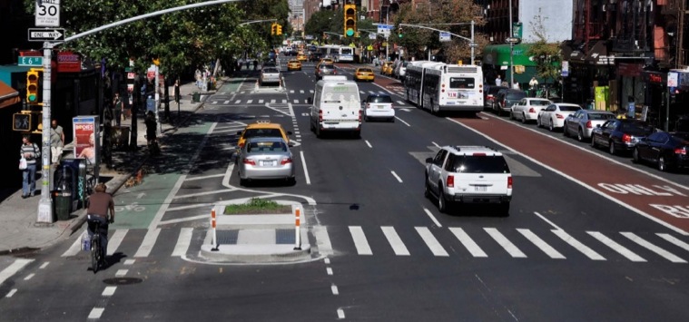New York City street with bus lane and protected bike lane (Image Credit: The Source)