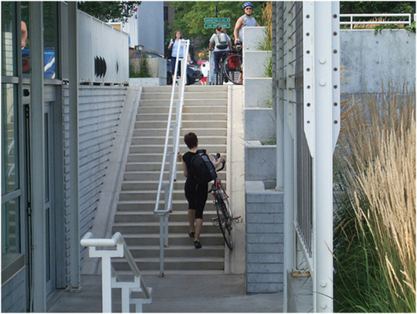 Bicycle stairs with right-handed user going up (Image Credit: Flickr)