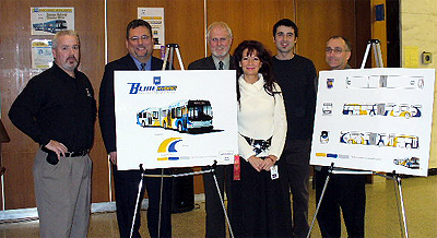 Dave Kuruc (2nd from right) is congratulated for his design