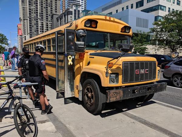 A YV protestor drove a bus onto the sidewalk during an anti-fascist demonstration at City Hall on August 10, 2019 (Image Credit: Cameron Kroetsch)