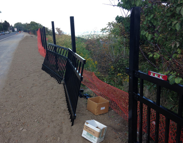 New fence beside Mountain Brow Boulevard