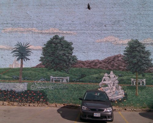 I found this mural in an alley that led to one of the many large and copious parking lots just behind the main streets