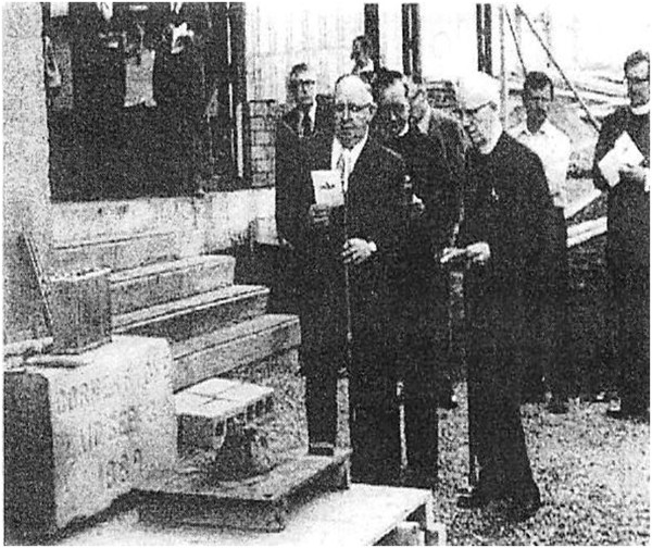 Laying together of the 1889 and 1977 cornerstone. It can still be seen at street level from King William Ave. Clerk of Sessions Gillis McKenzie is holding the dedication reading.