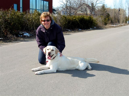 Mary Lou Tanner and her dog, Finnegan, demonstrate the use of Hamilton's Waterfront Trail