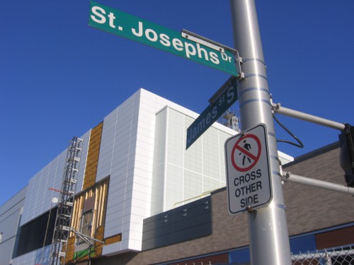 'Pedestrians Cross Other Side' sign on the north side of St. Joseph's Drive at James