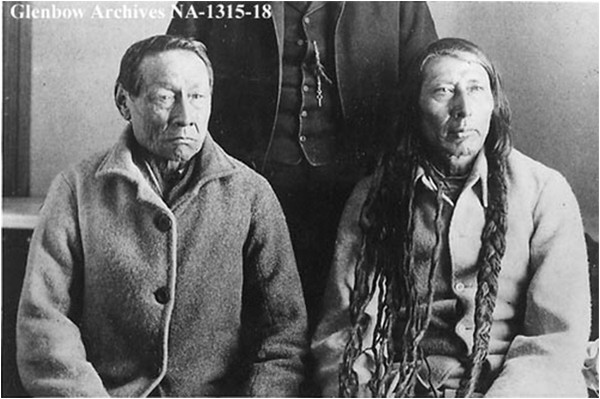 Big Bear and Poundmaker in captivity, 1886. Following the rebellion of 1885, a metis effort with little native participation, 46 metis and 81 natives were arrested. Seven metis and 44 natives were imprisoned, eight natives were hanged for murder. Big Bear's crime, in the eyes of Canadian authorities, was attempting to form an aboriginal alliance to renegotiate treaties so as to obtain contiguous reserves. A large native land block was the last thing Macdonald wanted, and his administrators in the west used hunger as a weapon to prevent it from coming about.