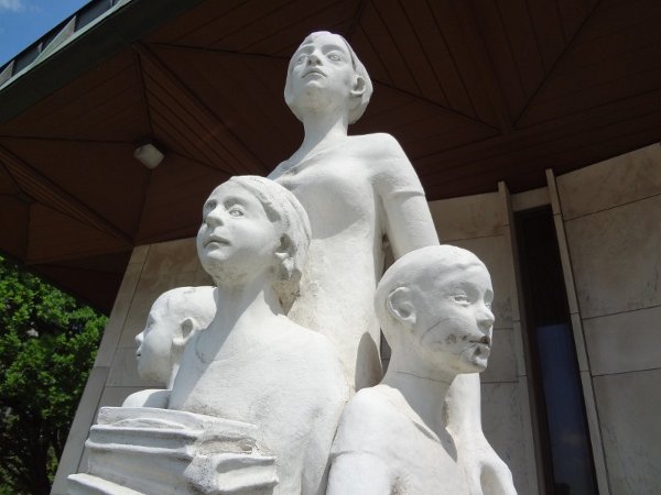 Statue: A teacher stands guard over her students at the doomed Education Centre (RTH file photo)