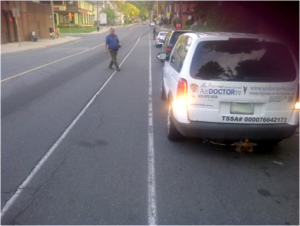 Car parked on the west curb on Dundurn Street South