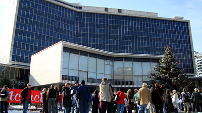 Supporters met in the sunny lee of City Hall, sheltered from the cold wind