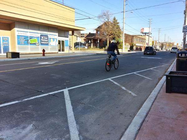 Cyclist riding in mixed traffic on Concession (Image Credit: Ryan McGreal)