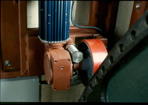 At the Hamilton Museum of Steam and Technology, a neoprene-clad friction wheel (red) runs on the surface of the flywheel at right, turning the flywheel and running the beam-engine 'backwards,' as it were.