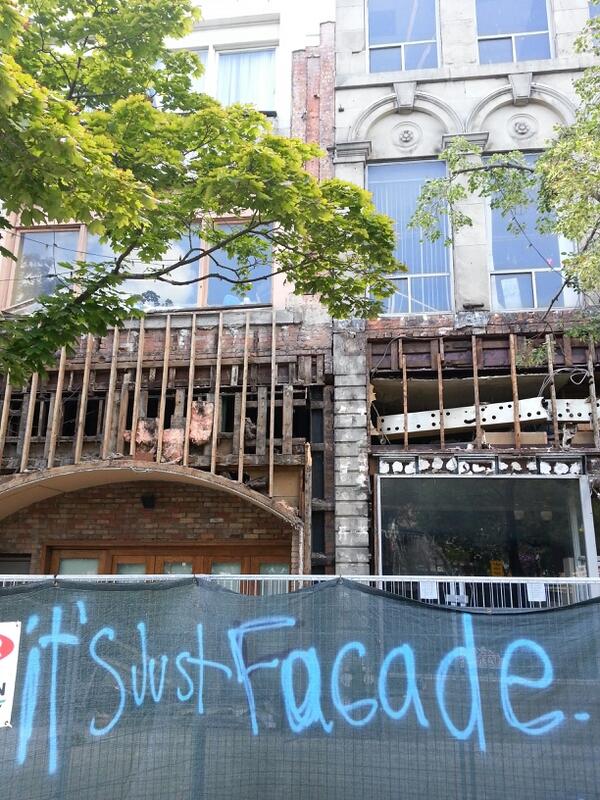 Graffiti sprayed on the fencing in front of 18-28 King Street East (RTH file photo)