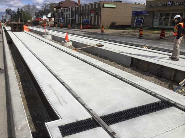 Median LRT track on 4-lane road being converted to 2 car lanes, 2 LRT lanes (Image Credit: Mark Rejhon)