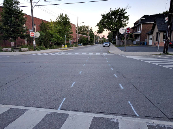 Pavement markings on Herkimer for bike lane installation