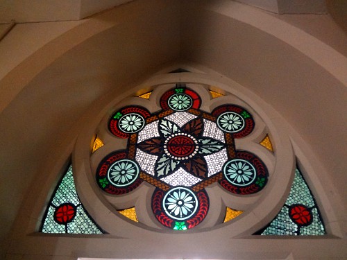 Some interior doorways feature stained glass mullion transoms