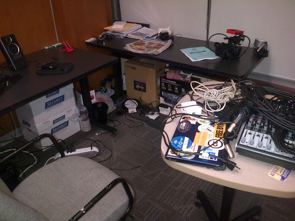 Joey Coleman's messy workstation at 10:00 PM after a Council meeting
