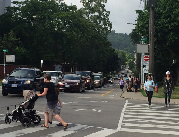 Note the large group of children, with one child walking in the bike lane
