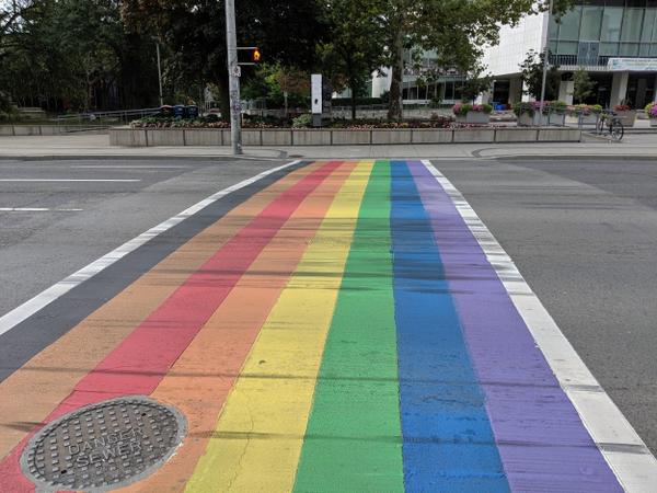 Rainbow crosswalk faded and covered in skid marks (Image Credit: Cameron Kroetsch)