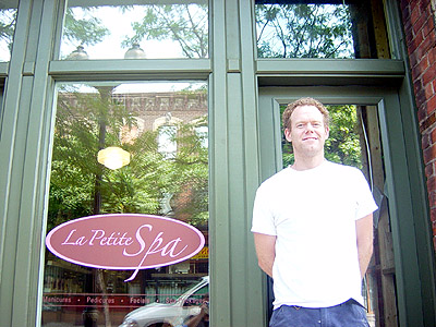 Gary Buttrum stands in front of the new facade for La Petite Spa