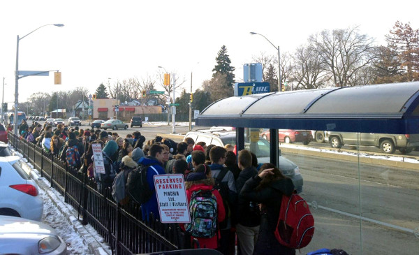 People waiting for the bus at Main and Longwood