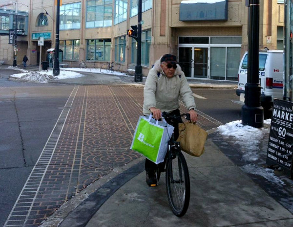 Cyclist pulling up at the Farmers' Market