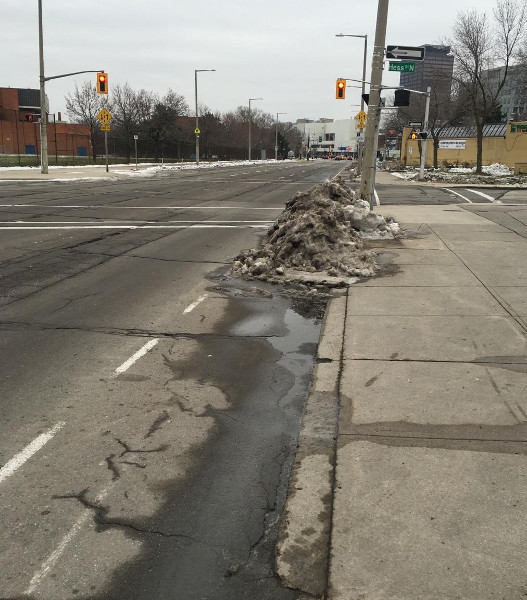 Ice pile blocking bike lane on York at Hess (Image Credit: Jason Leach)