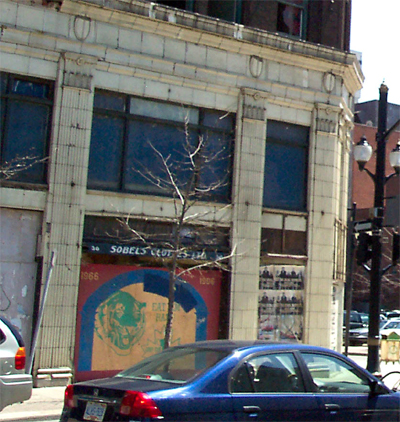 The terra cotta pilasters and capitals. The Sobel's Clothiers canopy can be seen