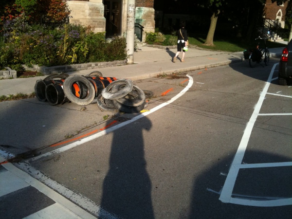 Plastic knockdown bollards removed from bumpout at northeast corner of Locke and Herkimer