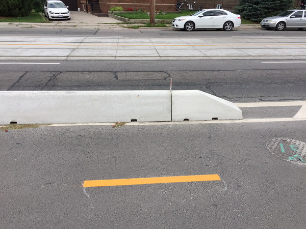 Bicycle lanes concrete protective barriers, side view