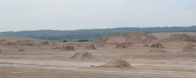 Mounds of earth, perhaps to mark the location of a future home