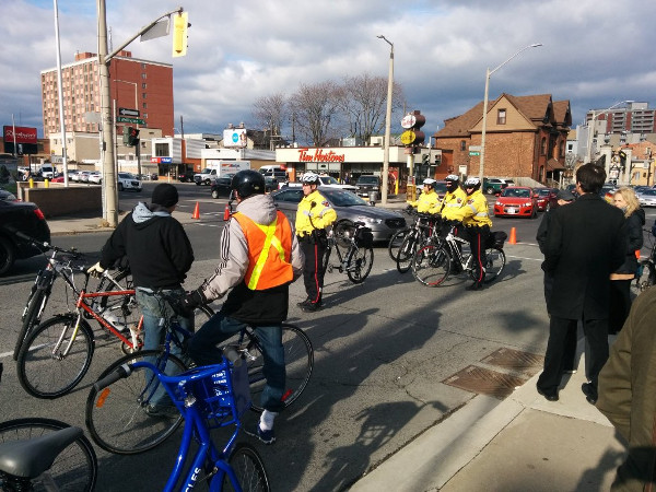 Police escorting the memorial walk participants (Image Credit: John Neary)