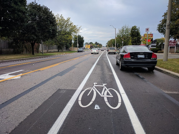 Narrower bike lane is right in the 'door zone' of parked cars