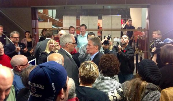 Outgoing Mayor Bob Bratina shares a word with Mayor-elect Fred Eisenberger (Image Credit: Jason Leach)