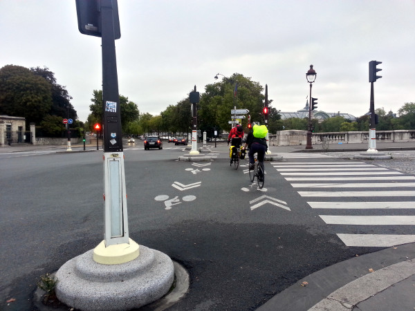 White painted bike lane stencils across intersection