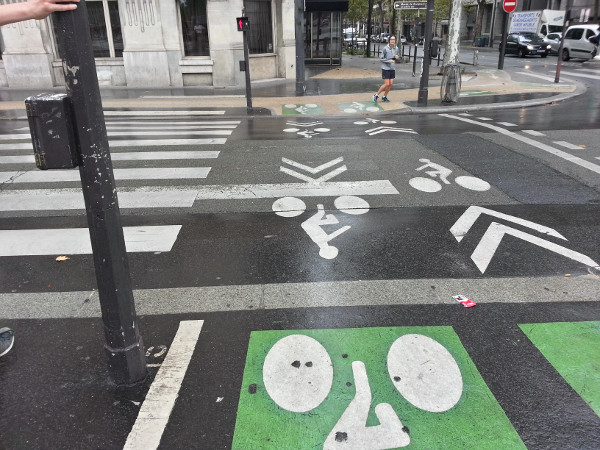 Pavement markings for off-street cycle track next to crosswalk markings