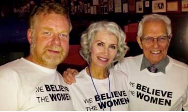 Regan with her partner Mark and her father, Bill at the Bill Cosby protest in 2015.