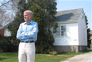 Richard Harris surveys
new housing development in a Hamilton neighbourhood. The house behind him was
part of a post-war development, the beginning of suburbia. (Image Credit:
McMaster University)