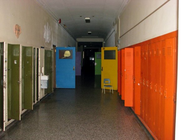 Terrazzo floor, walls and ceiling on main floor hallway in excellent shape.