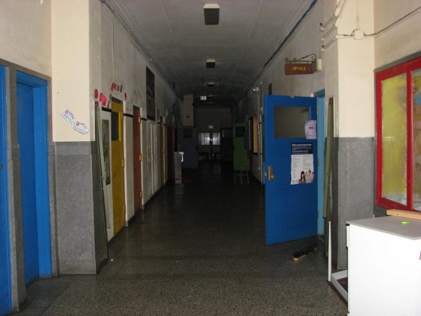 Terrazzo floor on main level hallway in excellent shape. All walls, doors and hardware in good condition.