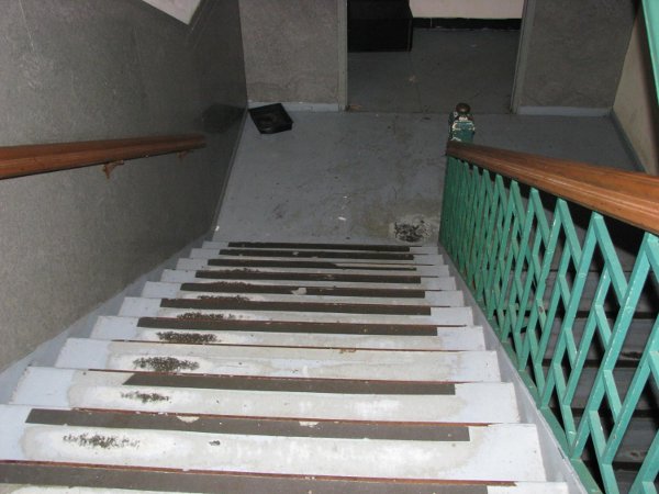 Minor repair and repainting of stair treads and landing floors.