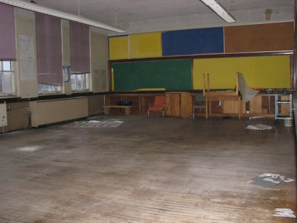 Glued carpet removal spots. Hardwood floors require sanding and polishing.