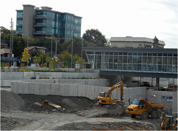 Additive reurbanization: the 1923 school is retained and enlarged upward, the 1860 Customs House is retained and adaptively reused, the 1931 rail station from which the photo was taken is retained and adaptively reused, and the 2015 GO transit station is inserted into the rail corridor already amended with a fibre optic trunk and a cellular tower. The result is a Pageant of Progress that would gladden the heart of the most philistine of municipal politicians.