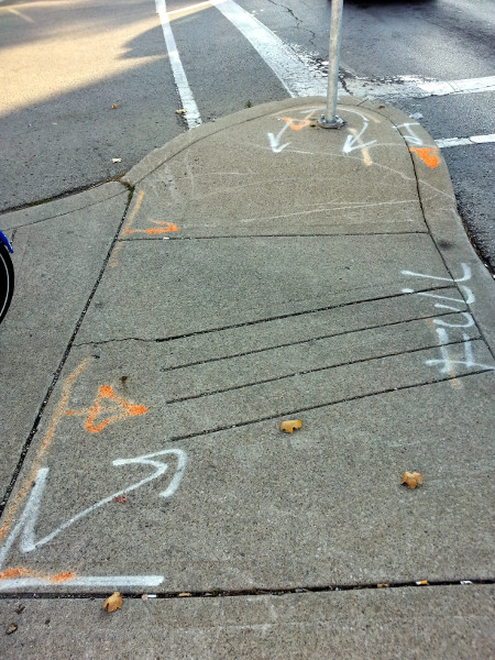 Markings on the pedestrian island at Cannon and Sherman