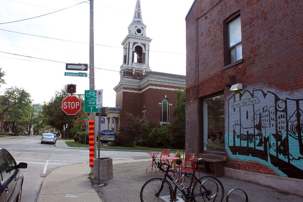 Bike parking and bike wayfinding sign at Durand Coffee, Charlton and Caroline
