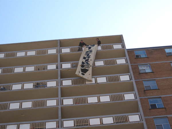 Stoney Creek Towers tenants began their rent strike at the end of April with a rally and banner drop.