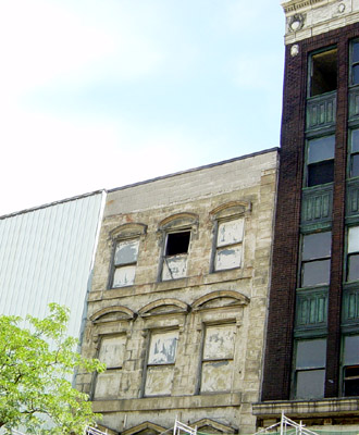 The Thomas Building, built 1854, is not depicted in the new rendering