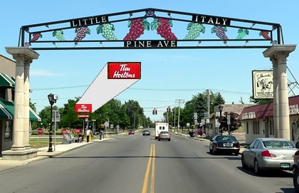 The deep setback and tall sign for this Tim Horton's breaks a Little Italy streetwall in Niagara Falls, NY.