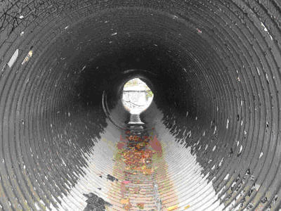 ...and does not make it out. What you do not see is the amount of erosion beneath the culvert. Is it minimal or significant? I would bet on minimal.